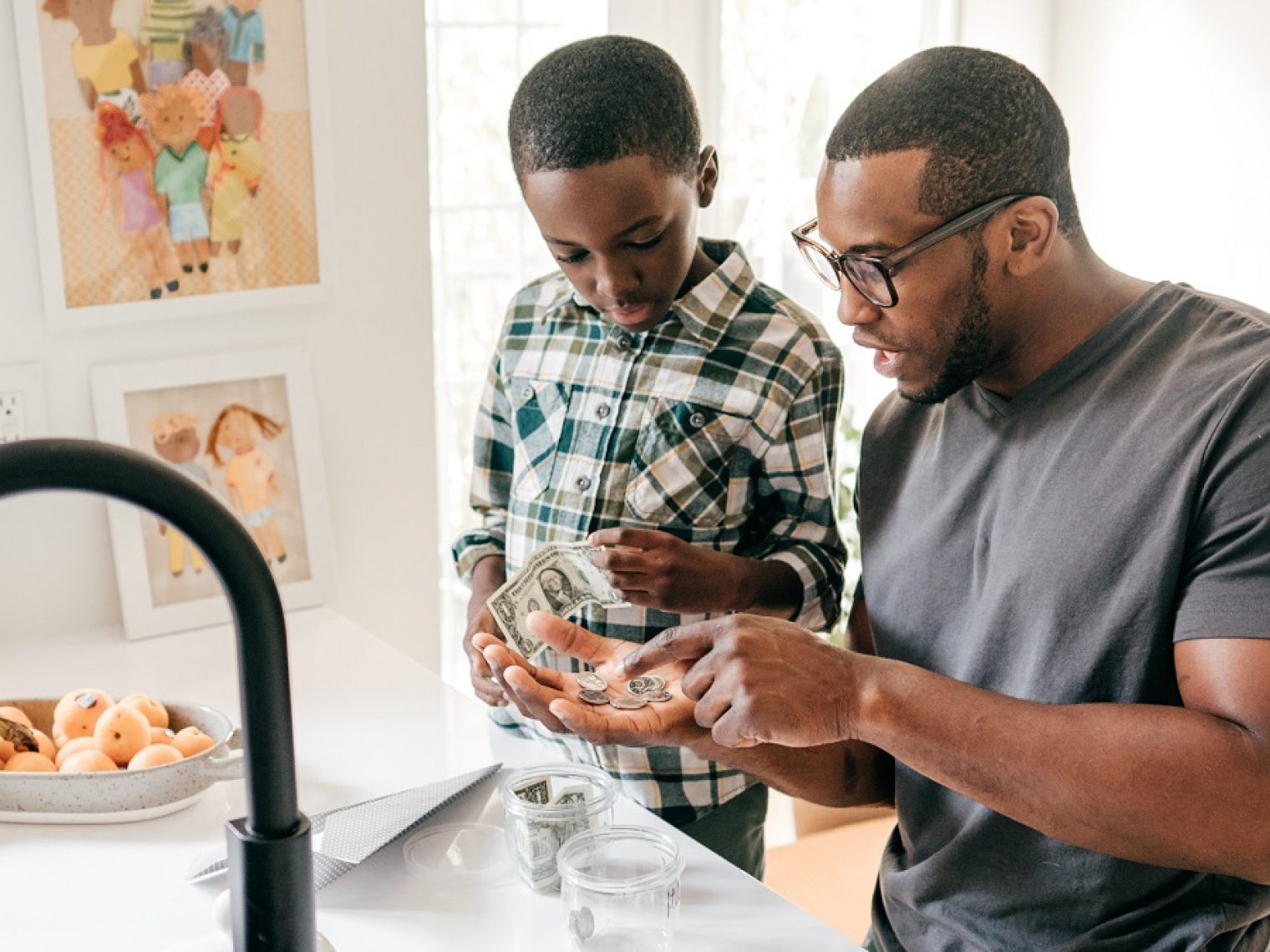 Father and son discuss saving money.