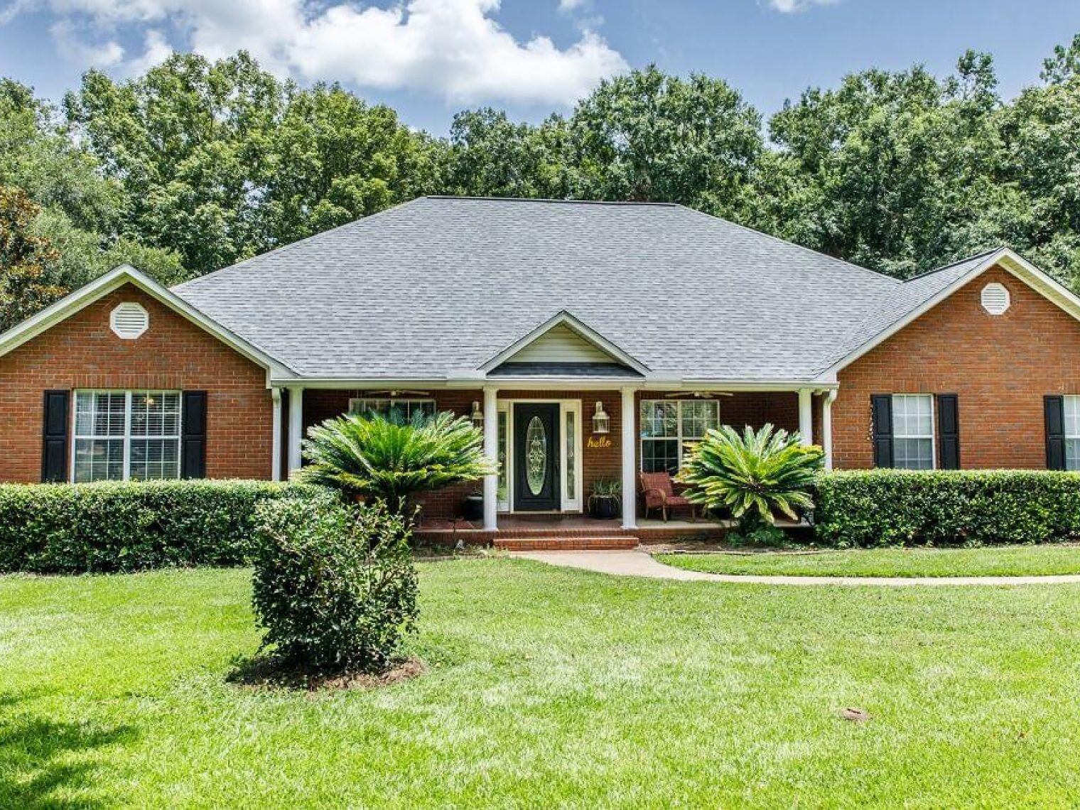 Picture of a home on green grass.