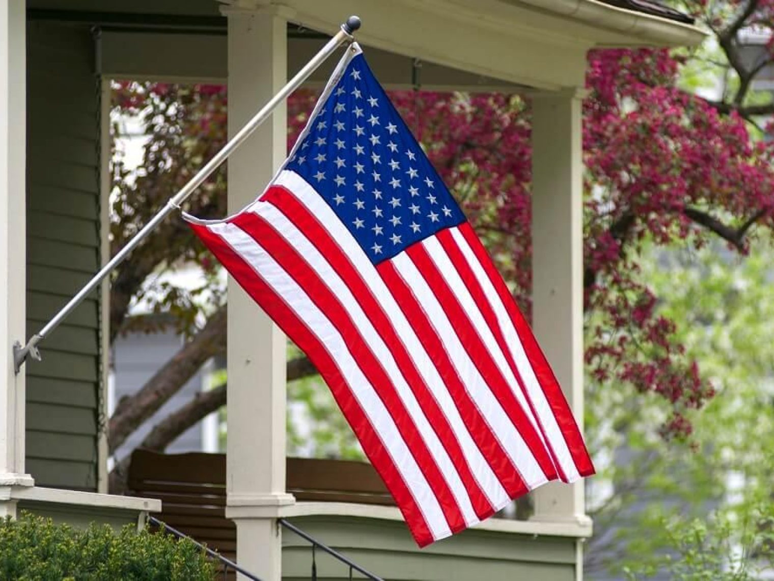 House with an American flag in front of it.