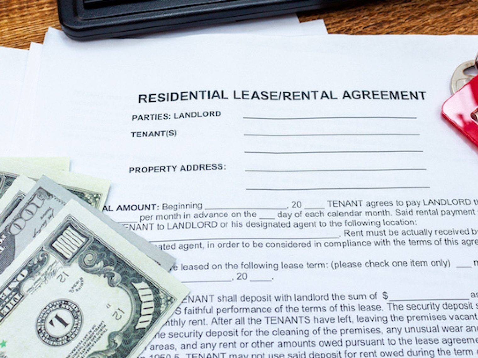 Rental/lease agreement on a table.